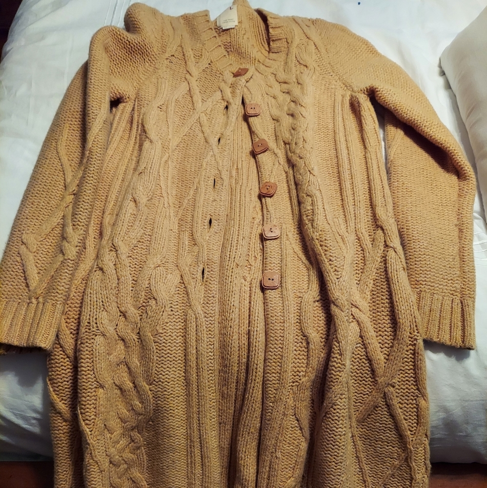 Thigh length cable sweater